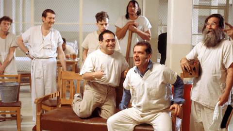 Jack Nicholson, dressed in white in a white room, yells invective at a group of eagerly listening asylum patients in One Flew Over the Cuckoo’s Nest