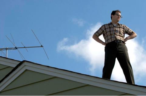 Larry (Stuhlbarg) stands on the roof.