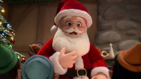 A stop-motion Santa Claus tells an audience of child elves a story in Alien Xmas