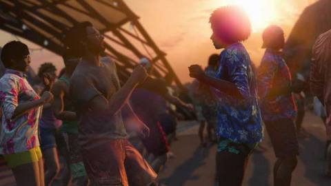 Grand Theft Auto Online - partygoers dance on a beach in Cayo Perico