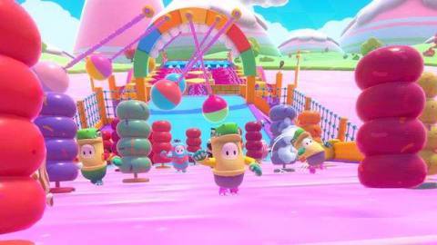 colorful, beanlike characters running en masse through an obstacle course