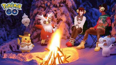 Trainers sit around a fire with Delibird, Pikachu, Cubchoo, and Vanillite