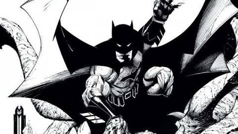 Image: Batman crouches, readying three batarangs, rendered all in black and white.