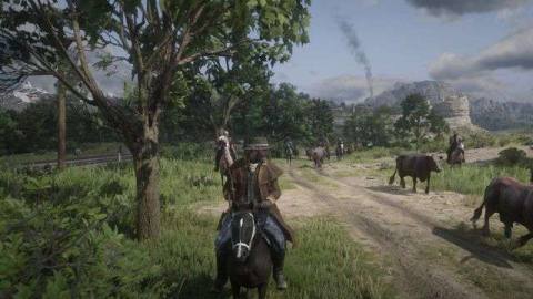 Red Dead Online - players, dressed as cowboys and riding horses, on a private server escort bovine down a dirt road