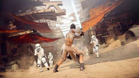 Rey holds her lightsaber in a defensive position as Stormtroopers run toward her 