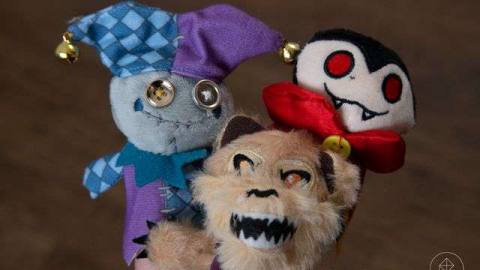 A jester, vampire, and werewolf finger puppet.