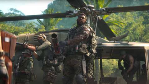 A new Call of Duty: Black Ops Cold War Operator stands in front of a helicopter with a minigun