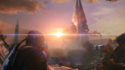 A Mass Effect character looks over a large structure with a sunset