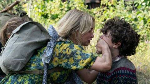 Evelyn (Emily Blunt) puts her hand over Marcus’ (Noah Jupe) mouth in A Quiet Place Part II