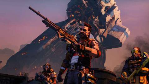Fuse from Apex Legends stands in front of some of the game’s other characters while holding a weapon
