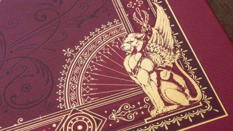 A close-up of the detail on the alternate front cover of Candlekeep Mysteries, with gold foil embossed graphics.