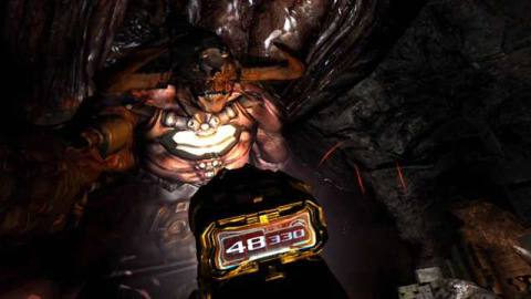 A giant looming demon with a gun and flashlight pointing at it from Doom 3 VR Edition.