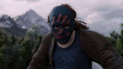 Erin Kellyman’s Karli Morgenthau readies for a fight, wearing a black mask with a red handprint, in The Falcon and the Winter Soldier.
