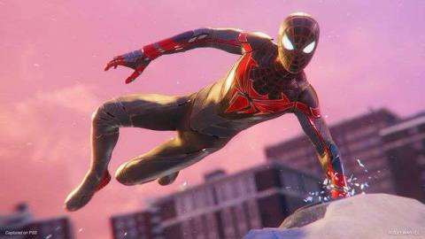 Miles Morales in his new advanced tech suit vaults over a rooftop.