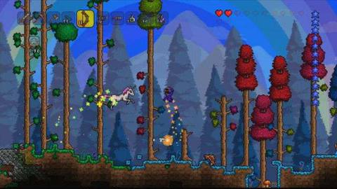 Terraria - a character moves through a colorful forest of red, green, and yellow trees