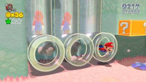 Marios move through clear pipes in a screenshot from Super Mario 3D World