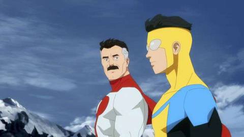 Omni-Man and his son Invincible side by side, in their superhero costumes
