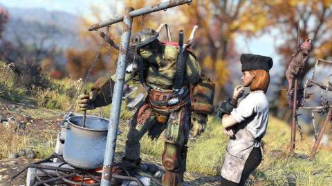 Fallout 76 - a supermutant stirs a big pot while a player wearing chef’s garments stands next to him, looking thoughtful