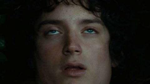 Frodo’s mouth falls open slackly as his eyes roll back in The Fellowship of the Ring. 