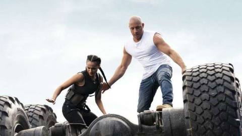  Ramsey (Nathalie Emmanuel) and Dom (Vin Diesel) atop an overturned truck in F9