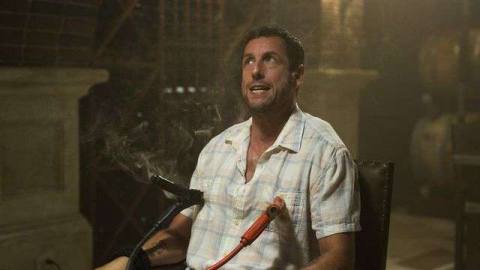 Adam Sandler strapped to a chair with car wires on his nipples in The Do-Over