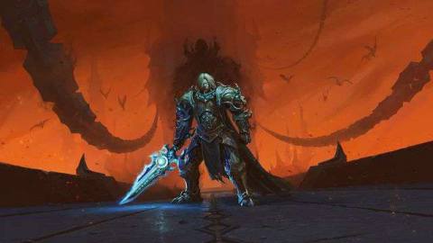World of Warcraft: Shadowlands - key art for the Chains of Domination patch, which shows a mind controlled Anduin Wrynn in grey and blue armor standing against an orange sky. In the distance, the silhouette of the Jailer looms.