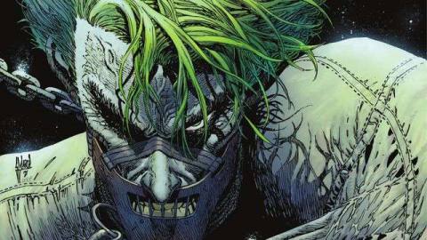 The Joker, chained, straightjacketed, and muzzled like Hannibal Lector, ominously stares with one eye at the viewer on the cover of The Joker #5 (2021). 