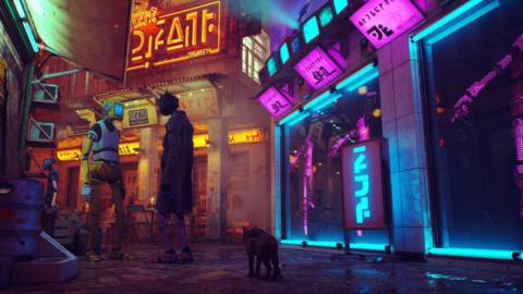 The cat emerges from the alley into a neon-lit street. Two robots wearing clothes converse.