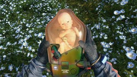 Sam holds BB in a screenshot from Death Stranding