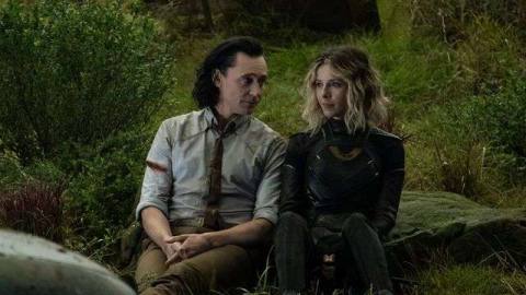Loki and Sylvie sit in the grass in the Void in Loki season 1