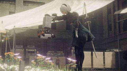 2B pets her satellite robot in a screenshot from Nier: Automata