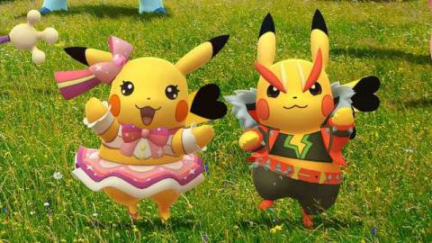 Pikachu Pop Star and Pikachu Rock Star dance in a field in artwork for Pokémon Go Fest 2021