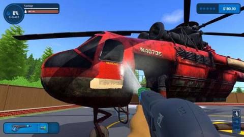 PowerWash Simulator - someone is cleaning a red helicopter with a power washer.