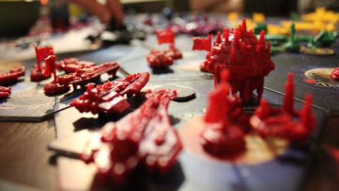 Red ships on the board for a game of Twilight Imperium.