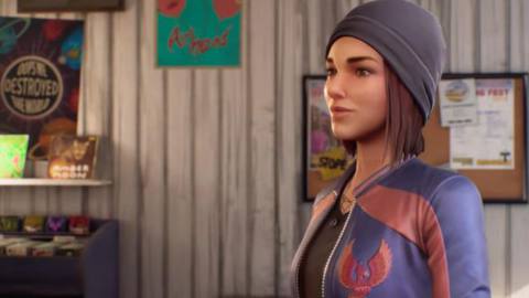 Life is Strange: Wavelengths - Steph, a young white woman with dark hair in a grey beanie stands in the record store, smiling to herself