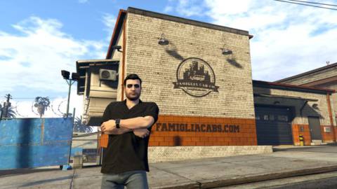 Grand Theft Auto Online - a player’s character, Tony Moretti, stands outside his cab company’s building on a GTA Online role-play server.