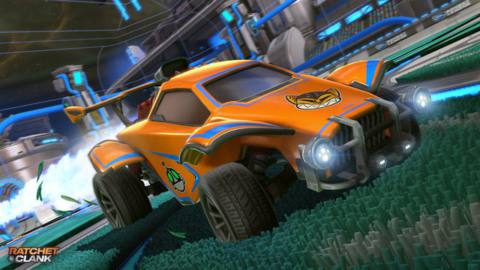 Rocket League - a car, decorated with Ratchet &amp; Clank decals, soars through the air majestically