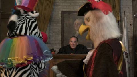 Judge Hal Wackner presides over a court attended by people in a zebra and eagle costumes in The Good Fight Season 5