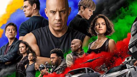 An F9 promo image, with Vin Diesel and the rest of the cast against a background of brightly colored smoke