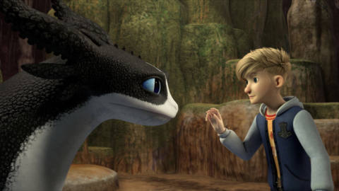 a blonde boy in a hoodie tentatively approaches a black and white dragon