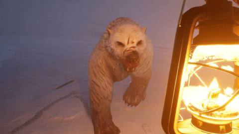Dread Hunger - a big angry undead polar bear approaches the player, who is holding a lantern