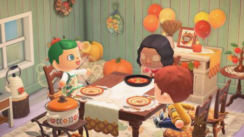 Three villagers sit at a table for a fall feast in Animal Crossing: New Horizons