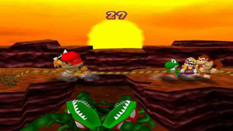screen of 1998’s Mario Party showing four Mushroom Kingdom characters (Mario, vs. Yoshi, Wario, and Donkey Kong) in a tug-of-war