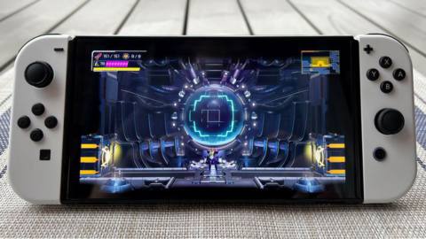 Metroid Dread on an OLED Nintendo Switch with white Joy-Cons