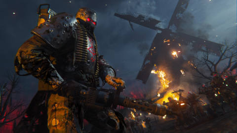 A tank Zombie with a machine gun stands by a burning windmill in Call of Duty: Vanguard