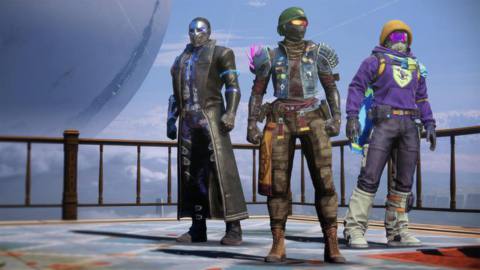 Three Guardians stand in the Tower in their Bungie 30th Anniversary gear