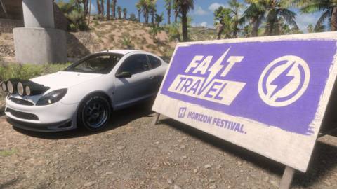 a white sports car next to a fast travel sign in Forza Horizon 5