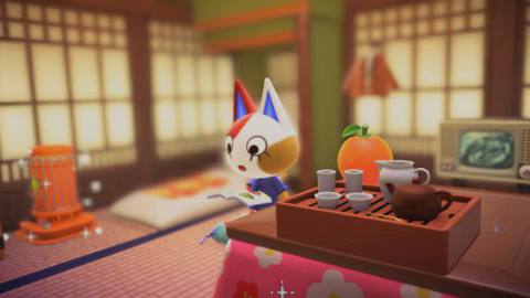 An Animal Crossing cat rests in a Japanese-styled home