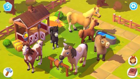 FarmVille 3- a bunch of cute cartoon horses stand outside their stables, looking up at the player.