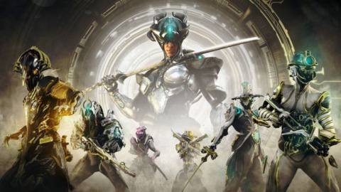 Warframe - a Dax soldier poses in the background in a sci-fi environment. In front of him are Prime versions of player-controlled Warframes in action poses